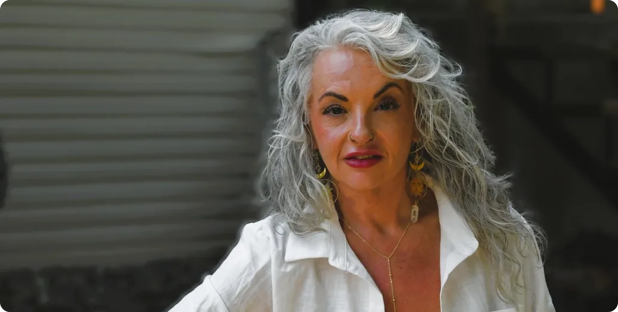 Woman with gray hair and white shirt